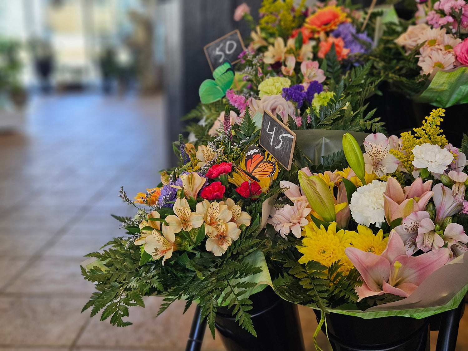 Bouquets of flowers with price tags in a store setting