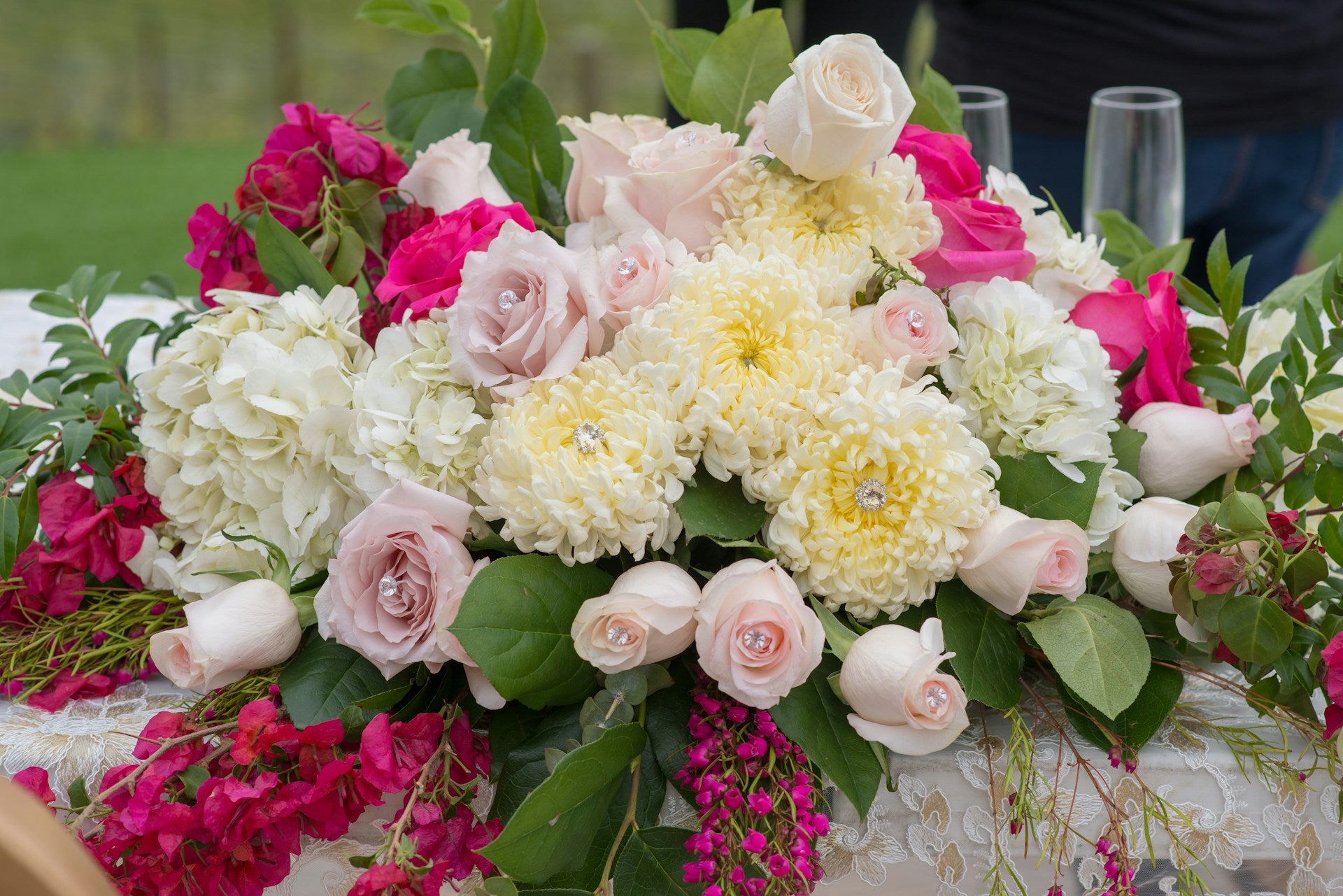 Bouquet of flowers with pink, white, and yellow colors on a table.